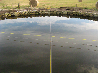 Finding the centre of the curve with a pond in the way!